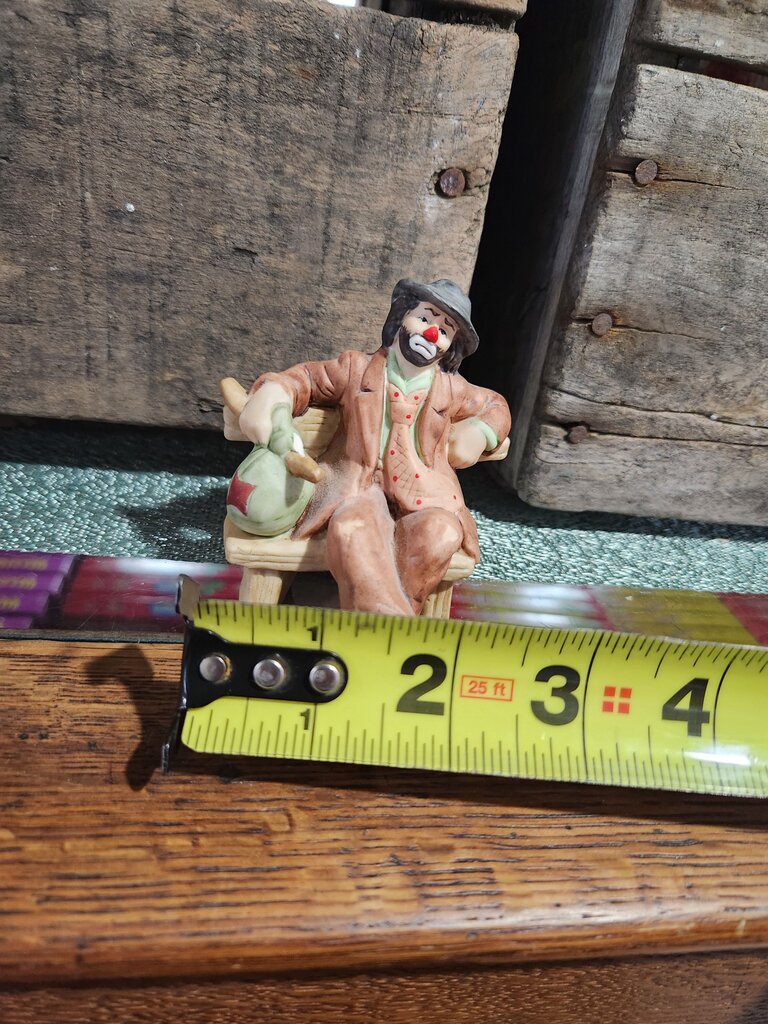 Collectible Clown Figurine Sitting on Bench